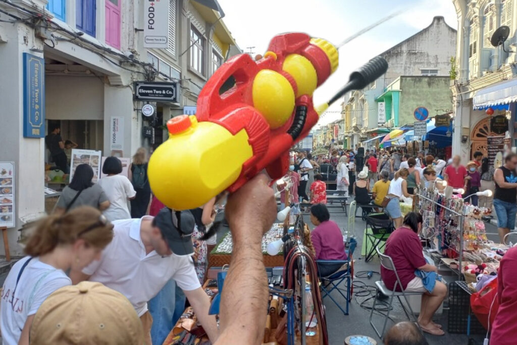 Where can I enjoy a water splash during the Songkran festival in Phuket?