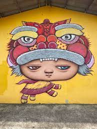 Nong Mardi on a wall in the Talad Tai hamlet, Krasom Subdistrict Municipality